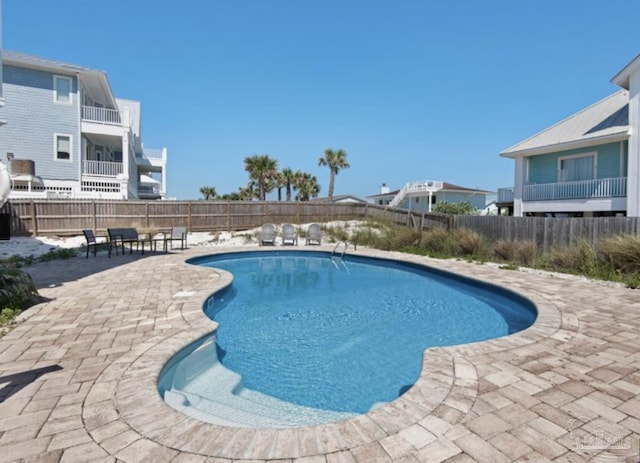 view of swimming pool with a patio