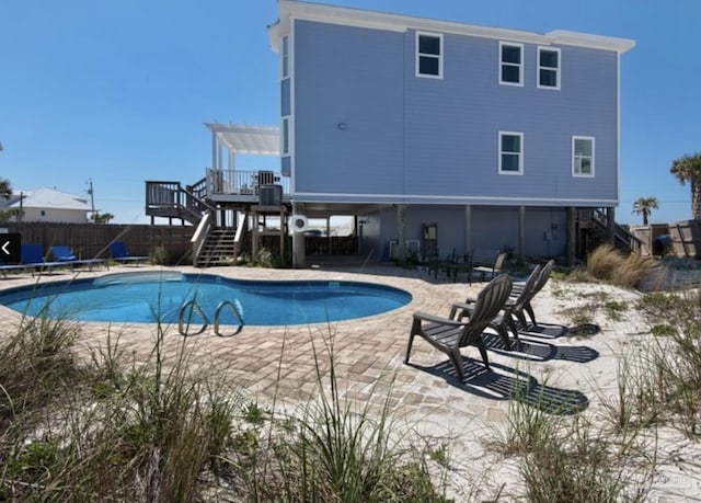 view of pool with a pergola and a patio