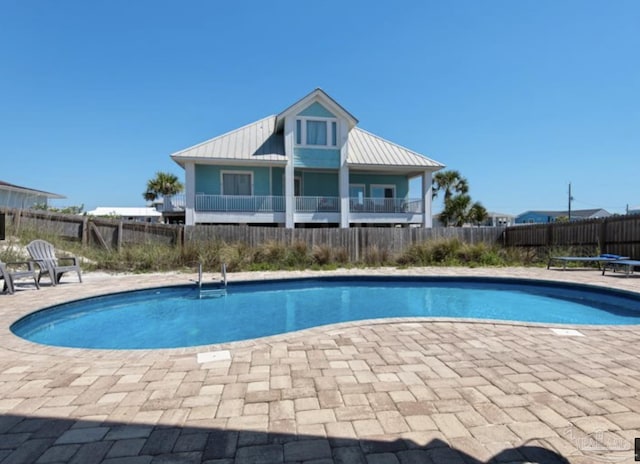 view of swimming pool featuring a trampoline