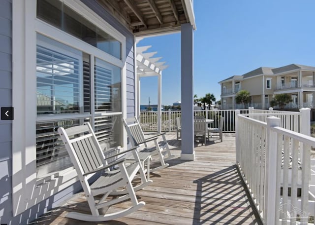 wooden deck featuring a pergola