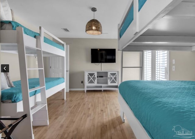 bedroom with wood-type flooring