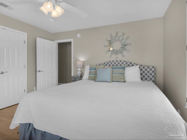 bedroom featuring ceiling fan and wood-type flooring