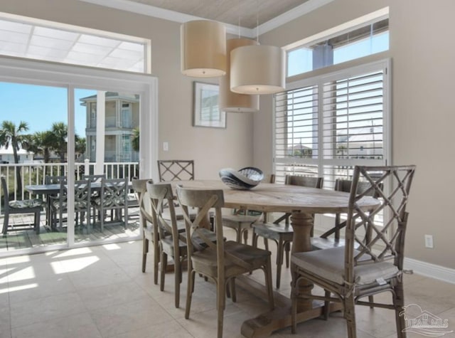 dining room with plenty of natural light and ornamental molding