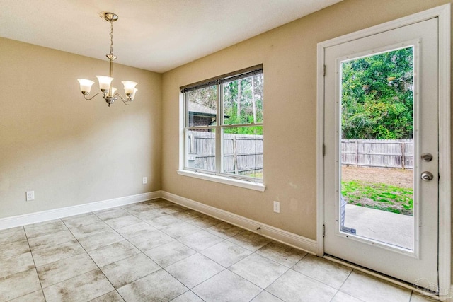 interior space with light tile patterned flooring and a chandelier