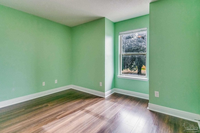 empty room featuring hardwood / wood-style flooring