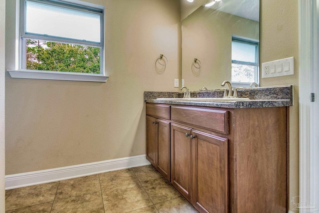 bathroom featuring tile patterned floors and vanity