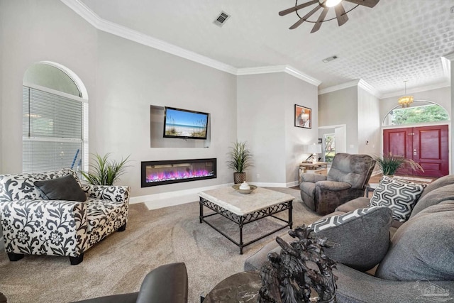 1328 Tour Dr, Gulf Breeze, FL 32563 - carpeted living area with baseboards, ceiling fan, crown molding, and a glass covered fireplace