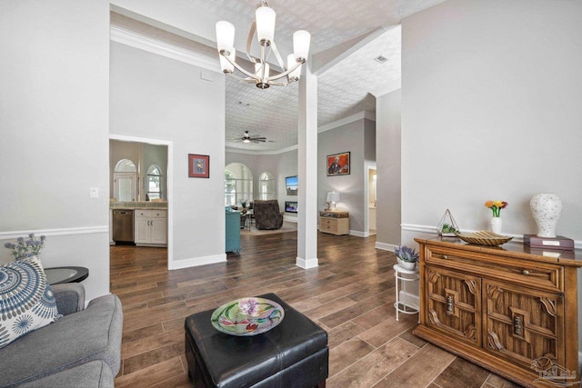 1328 Tour Dr, Gulf Breeze, FL 32563 - living room with a chandelier, wood finished floors, ornamental molding, and baseboards