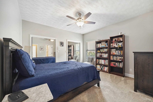 1328 Tour Dr, Gulf Breeze, FL 32563 - carpeted bedroom featuring a textured ceiling, ceiling fan, and baseboards