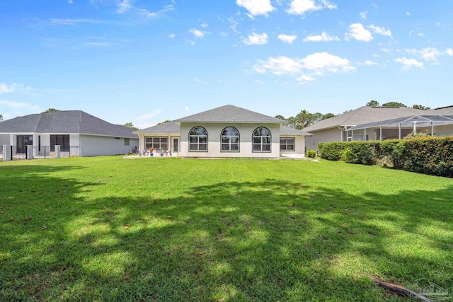 1328 Tour Dr, Gulf Breeze, FL 32563 - back of property with a lawn and stucco siding