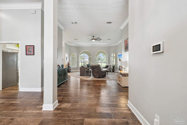 1328 Tour Dr, Gulf Breeze, FL 32563 - hall featuring crown molding, dark wood-style floors, baseboards, and a textured ceiling