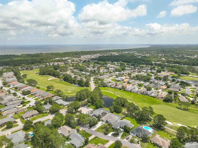 1328 Tour Dr, Gulf Breeze, FL 32563 - aerial view of property's location with a golf course, nearby suburban area, and a large body of water
