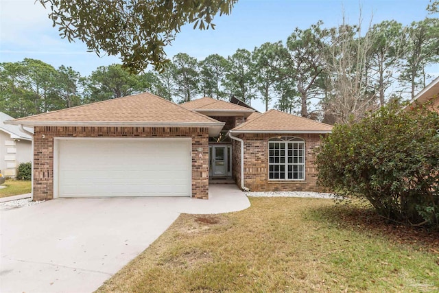 view of front facade with a garage and a front lawn