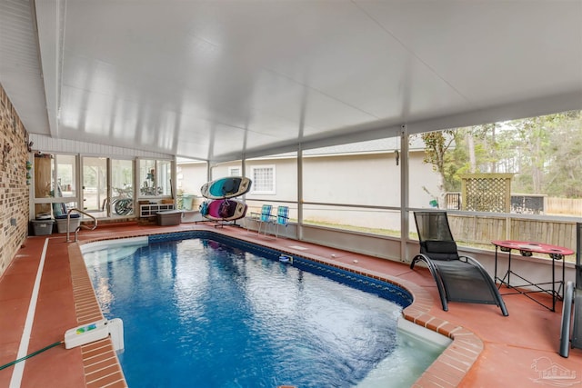 view of pool featuring a patio and glass enclosure