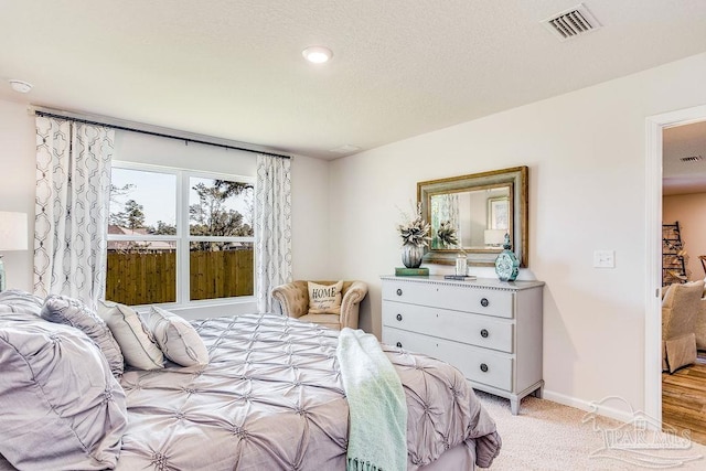 6340 Firefly Dr, Milton, FL 32583 - bedroom featuring baseboards, visible vents, and light carpet