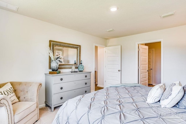 6340 Firefly Dr, Milton, FL 32583 - bedroom with baseboards, light carpet, and visible vents