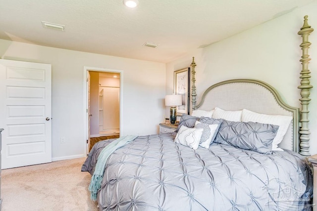 6340 Firefly Dr, Milton, FL 32583 - bedroom featuring baseboards, ensuite bathroom, carpet flooring, and visible vents