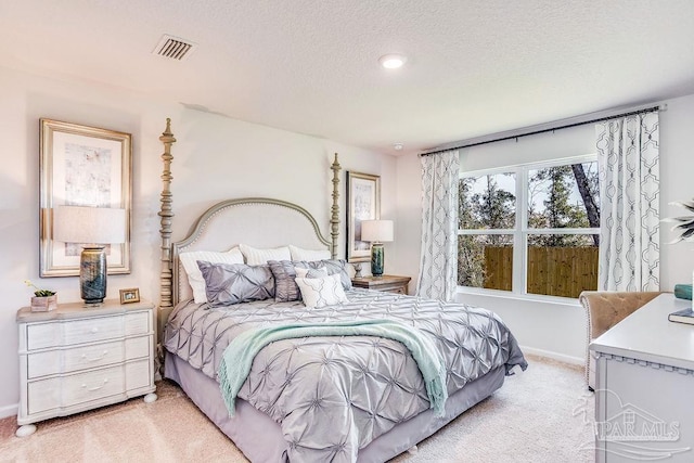 6340 Firefly Dr, Milton, FL 32583 - bedroom with a textured ceiling, light colored carpet, baseboards, and visible vents