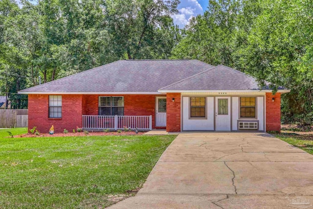 ranch-style home with a front lawn and covered porch