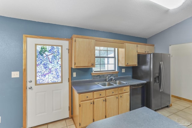 kitchen featuring appliances with stainless steel finishes, sink, light brown cabinets, and light tile patterned floors