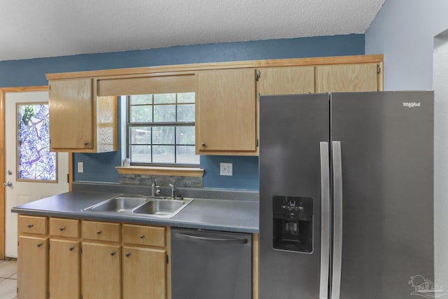 kitchen with sink, black dishwasher, stainless steel fridge with ice dispenser, and a textured ceiling