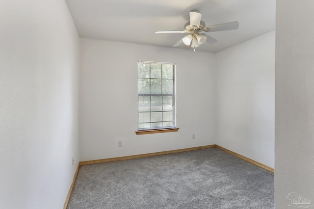 empty room featuring carpet floors and ceiling fan