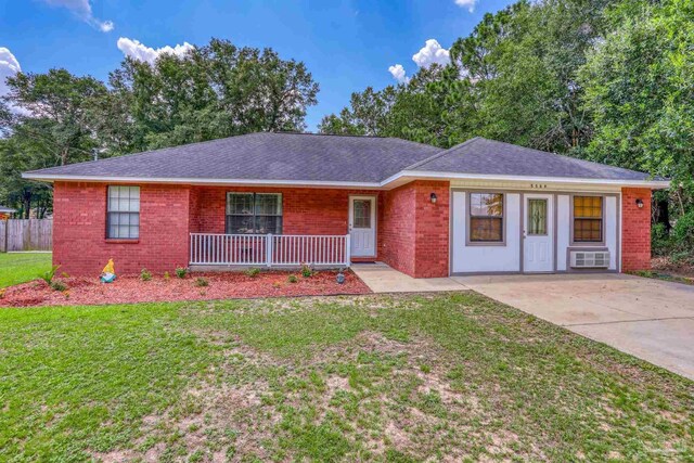 ranch-style house with a porch and a front lawn