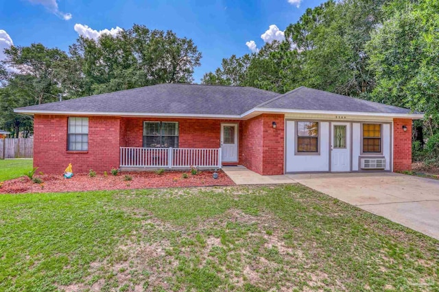 single story home featuring a porch and a front yard