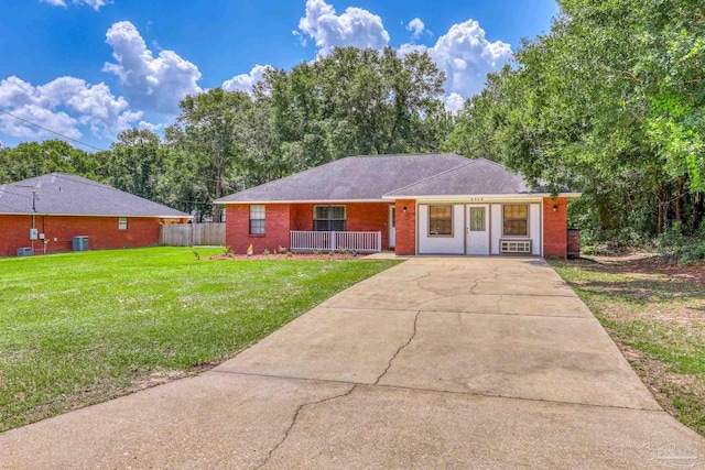 single story home with a front yard and covered porch