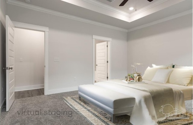 carpeted bedroom featuring ceiling fan, a raised ceiling, recessed lighting, baseboards, and ornamental molding