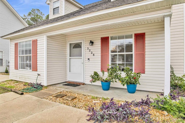 doorway to property featuring covered porch