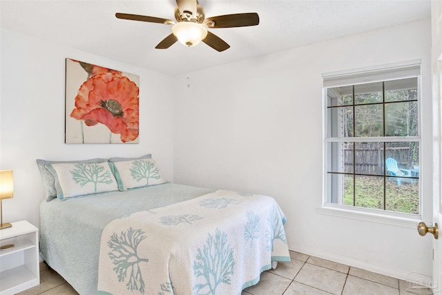 3228 Birdseye Cir, Gulf Breeze, FL 32563 - bedroom with multiple windows, tile patterned flooring, and a ceiling fan