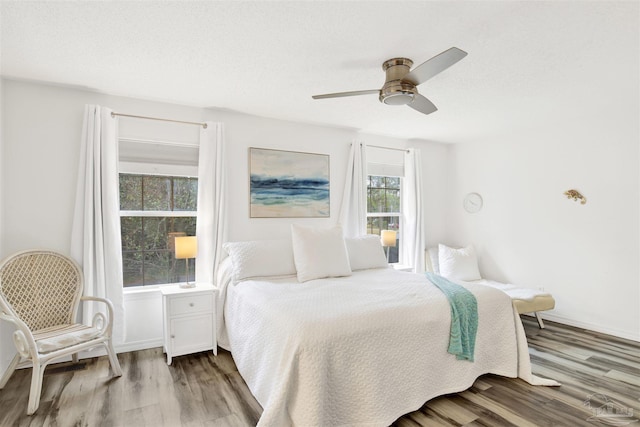 bedroom with light wood-type flooring and ceiling fan