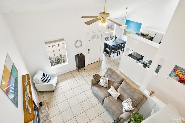 3228 Birdseye Cir, Gulf Breeze, FL 32563 - living area with high vaulted ceiling, light tile patterned floors, plenty of natural light, and a ceiling fan