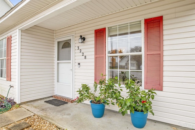 3228 Birdseye Cir, Gulf Breeze, FL 32563 - doorway to property featuring a porch