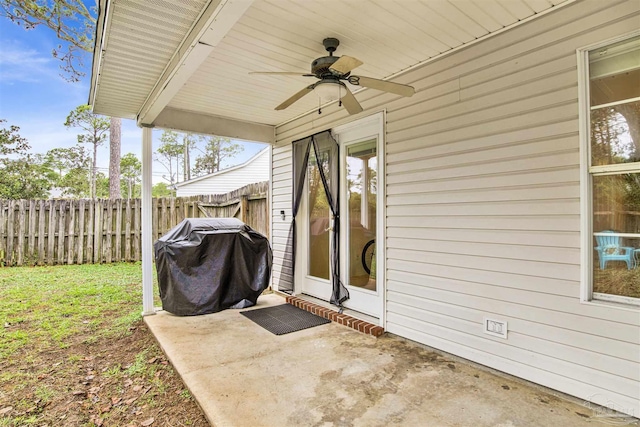 view of patio featuring ceiling fan and a grill