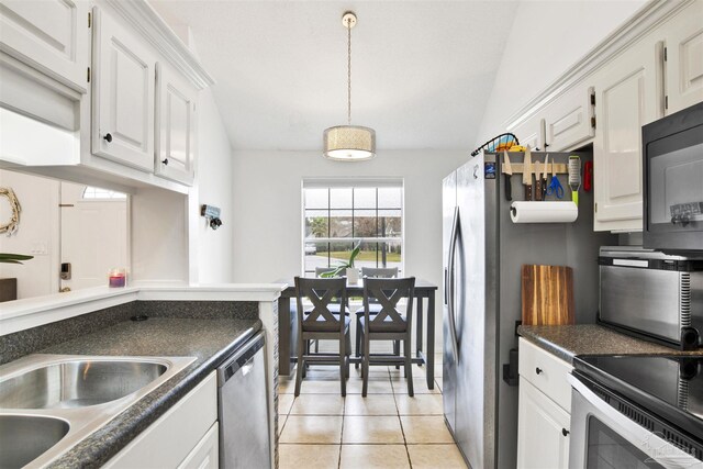 3228 Birdseye Cir, Gulf Breeze, FL 32563 - kitchen featuring stainless steel appliances, dark countertops, white cabinets, light tile patterned flooring, and pendant lighting