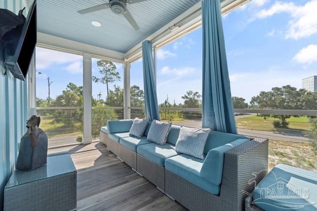 sunroom / solarium with ceiling fan