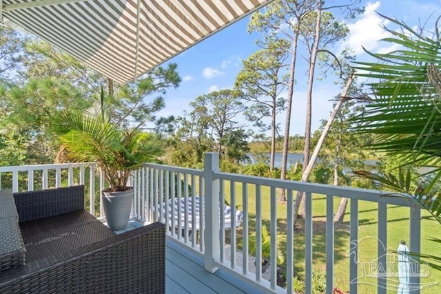 wooden terrace with a water view