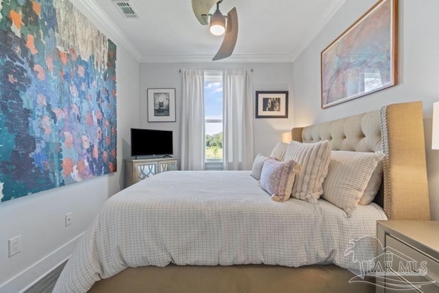 bedroom featuring ceiling fan and ornamental molding