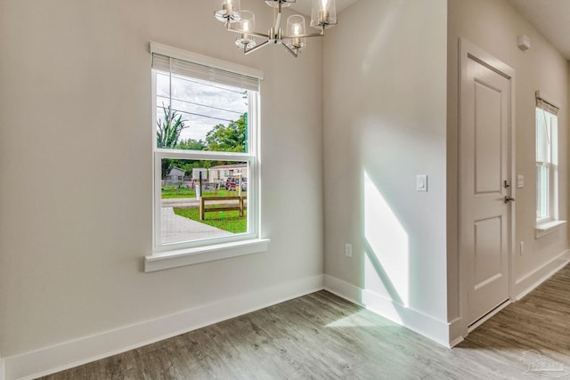 interior space featuring a chandelier and hardwood / wood-style floors