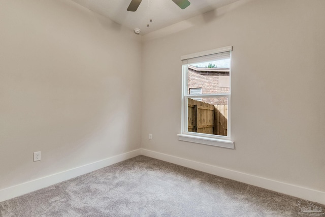 empty room featuring carpet flooring and ceiling fan