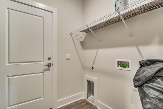 laundry area featuring dark wood-style floors, hookup for a washing machine, hookup for an electric dryer, laundry area, and baseboards