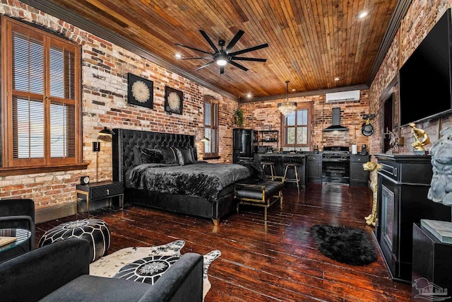 bedroom with ceiling fan, an AC wall unit, dark wood-type flooring, and brick wall