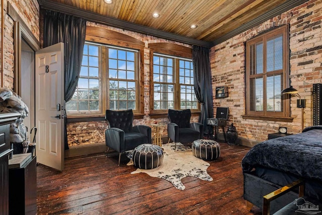 bedroom with wooden ceiling, brick wall, and dark hardwood / wood-style floors