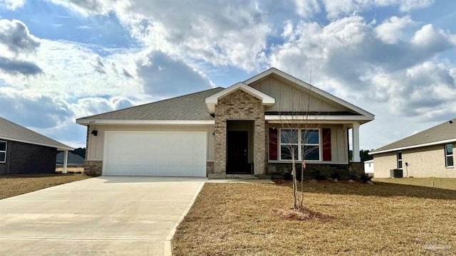 view of front facade featuring a shingled roof, concrete driveway, an attached garage, central air condition unit, and board and batten siding