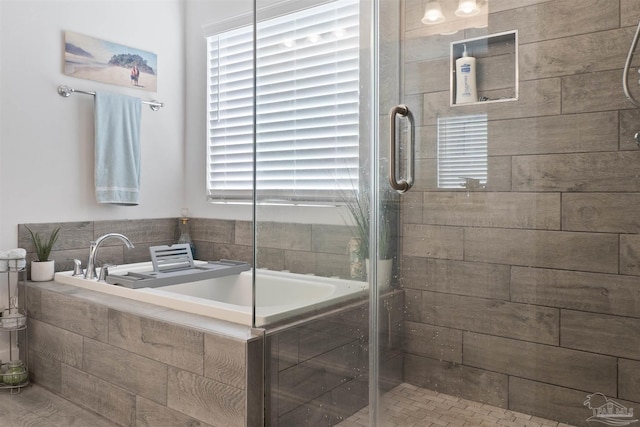 bathroom with separate shower and tub