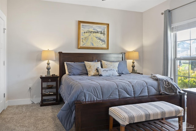 bedroom featuring light carpet