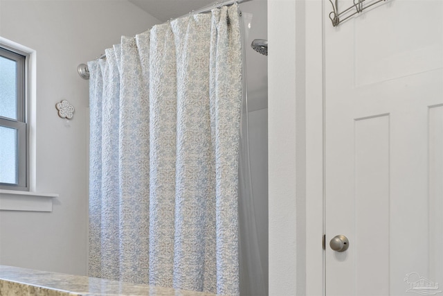 bathroom with curtained shower