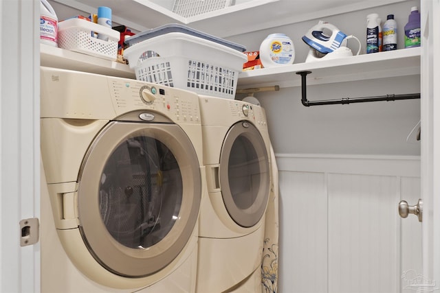 clothes washing area with separate washer and dryer